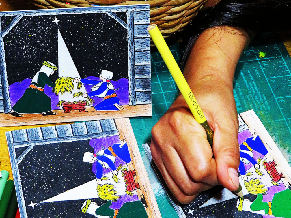 A Subanen crafting a Christmas card