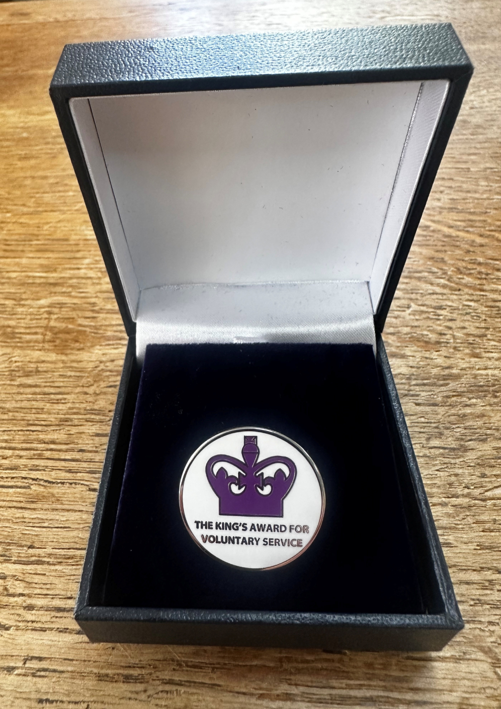 Fr. Ray's enamel King's award pin badge whcih was presented to him and teh other volunteers from Bethal in a speccial award's ceremony