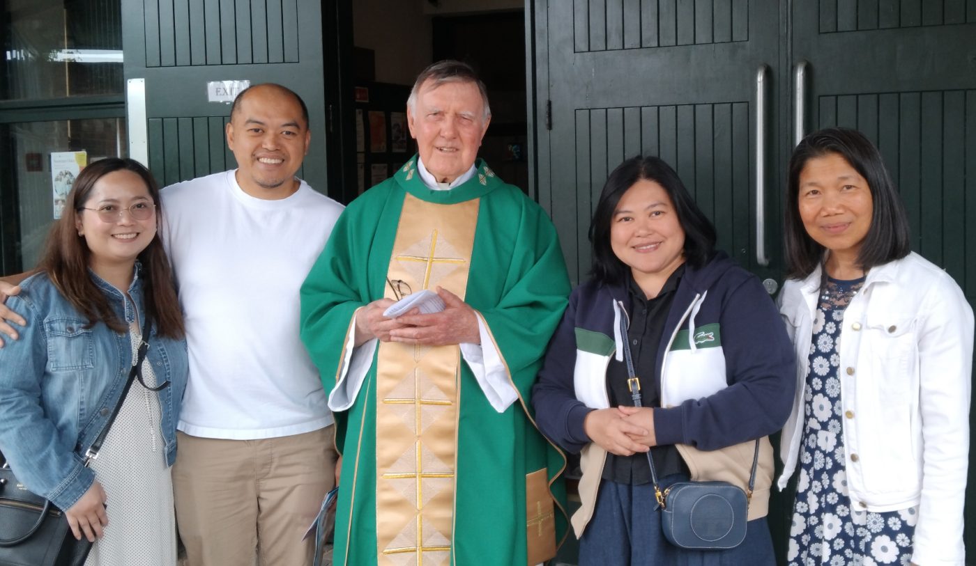 Lay missionary Angie Escarsa (right) with Columban Fr. Sean Coyle (centre), CLMCLT Coordinator Sherryl Lou Capili, and Sherryl’s brother and sister-in-law during a mission appeal at St. Charles Borromeo
