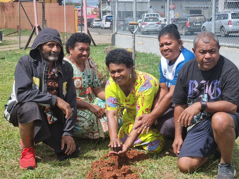 Parish Council members planting a tree during the Season of Creation