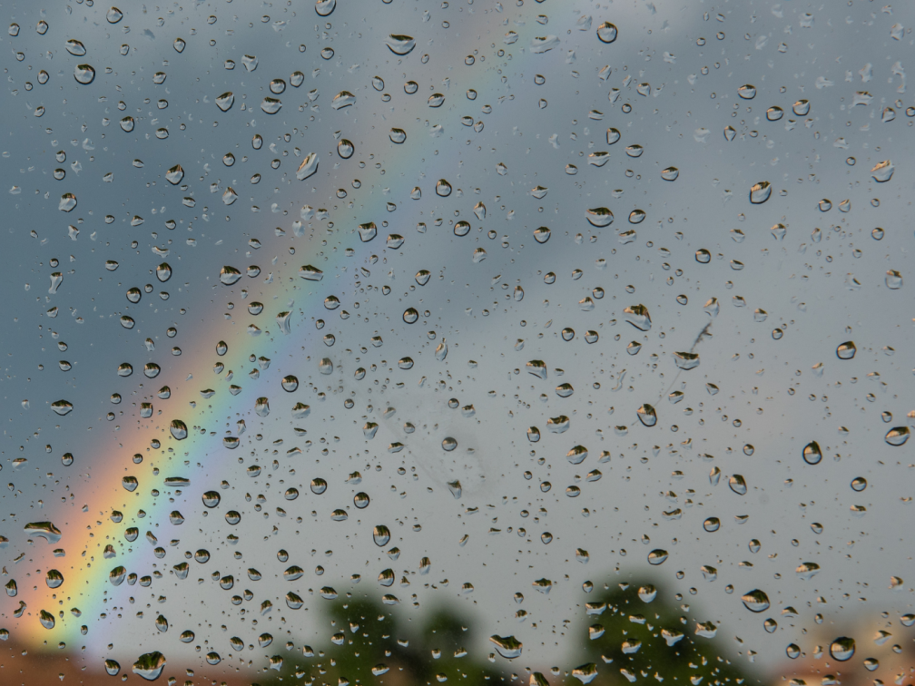 A rainbow set against a grey sky: Image credit: Canva.com