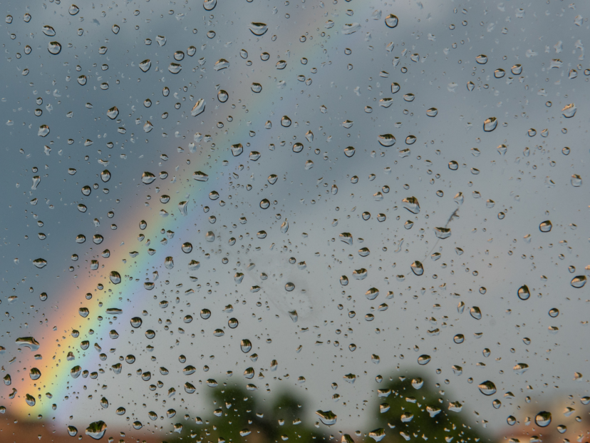 A rainbow set against a grey sky: Image credit: Canva.com
